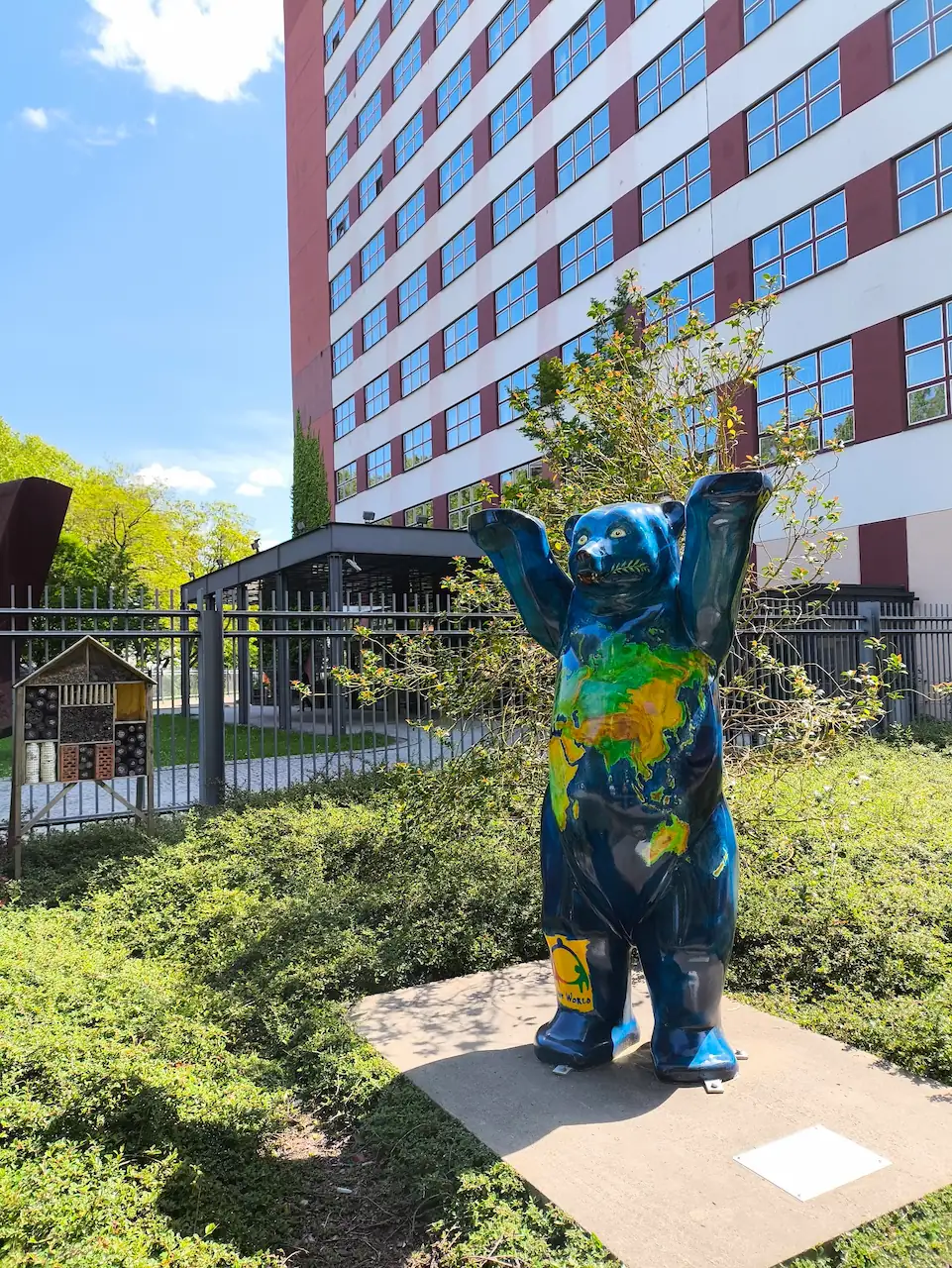 photo of a bear statue. The bear has an earth skin